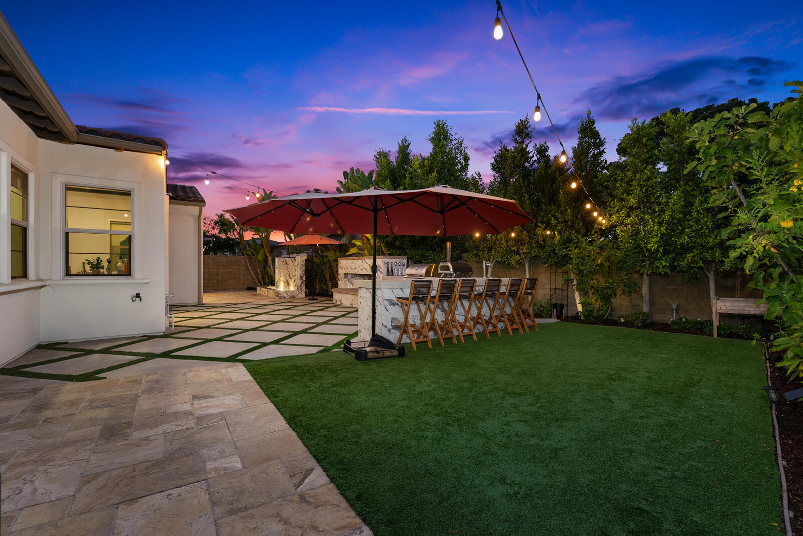 Backyard at sunset with string lights